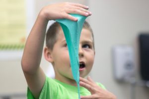 kid playing with orthodontic wax