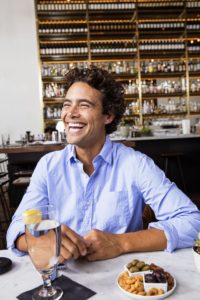 Man with Invisalign smiling
