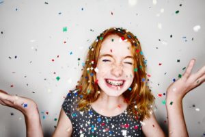 Girl smiling with confetti