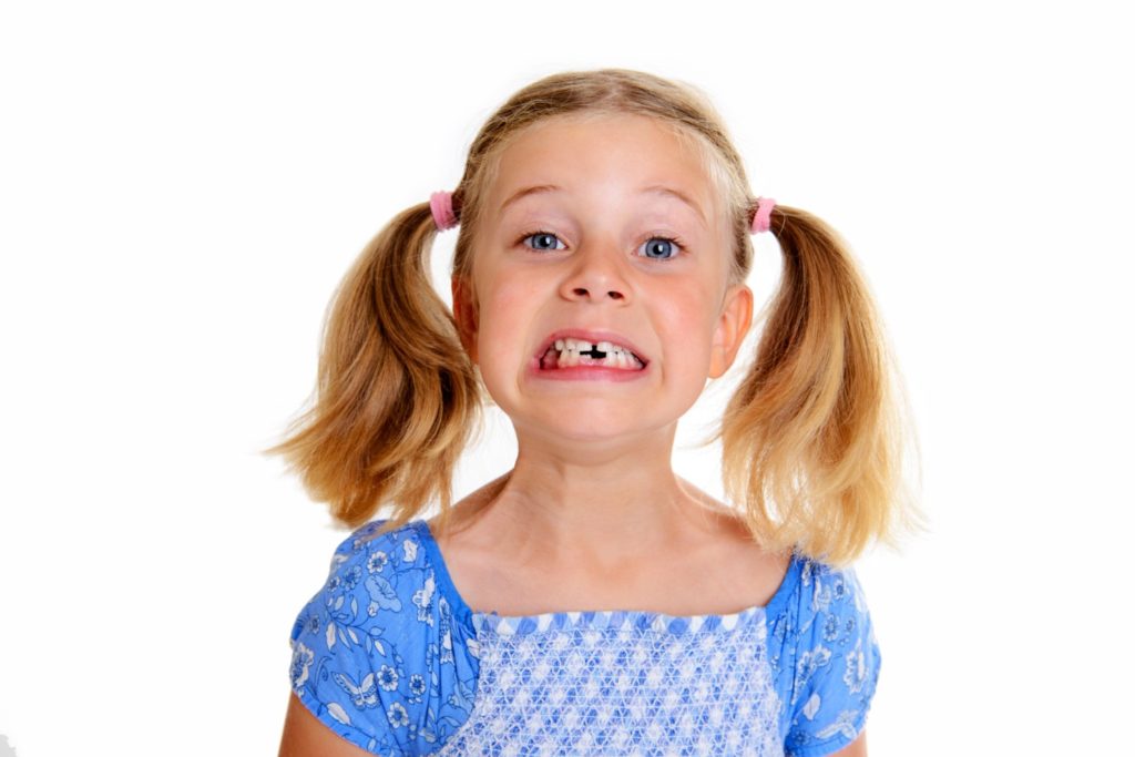 girl missing a tooth