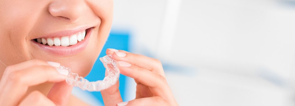 woman using Invisalign