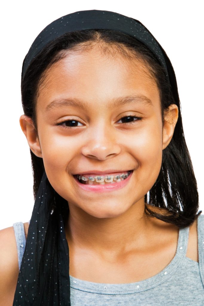 Smiling young girl with braces 