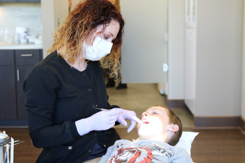Dillehay assistant with patient