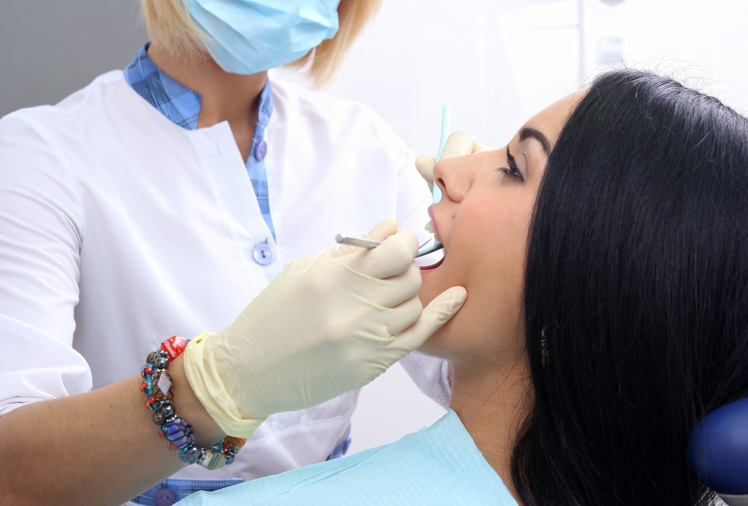 Examining a patient's teeth
