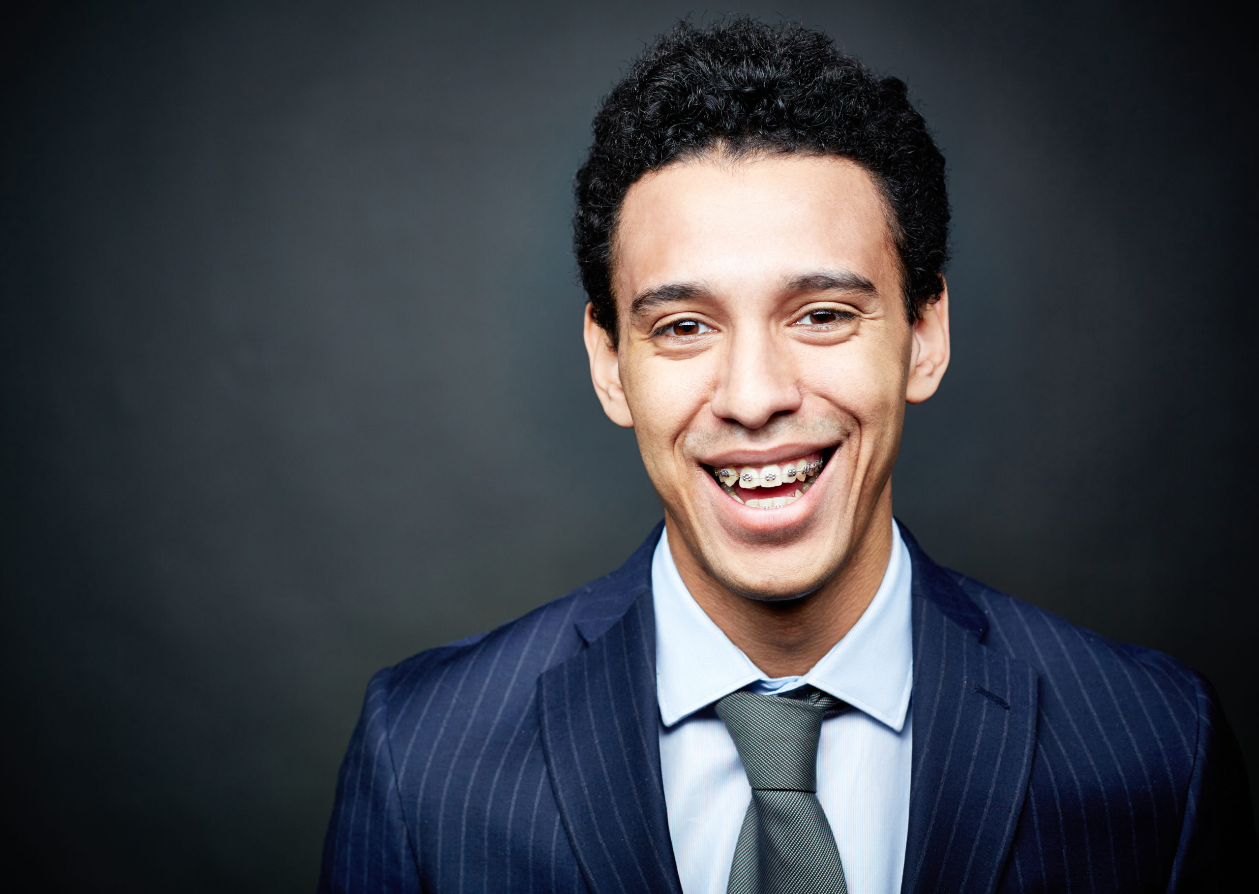 Young man in a suit with braces