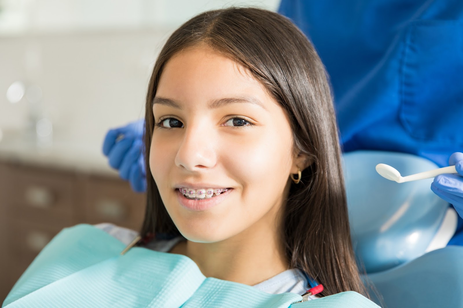 Girl at dentist with braces